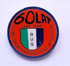 Odznaka 60 lat KS Bug Wyszków 1922-1982 pomarańczowa (PRL, plastik)