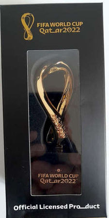 Replika 3D oficjalny znak logo Mistrzostwa Świata Katar 2022 na podstawce, pozłacana (produkt oficjalny) 10 cm