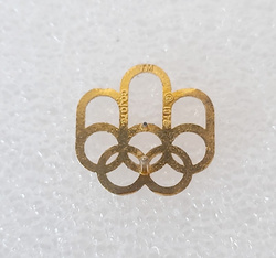 Odznaka Letnie Igrzyska Olimpijskie Montreal 1976 logo, pozłacana (produkt oficjalny)