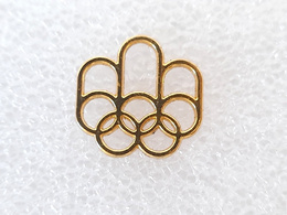 Odznaka Letnie Igrzyska Olimpijskie Montreal 1976 logo, pozłacana (produkt oficjalny)